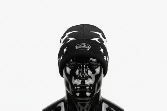 Black beanie with white star patterns and 'Untouchable' logo on a white background
